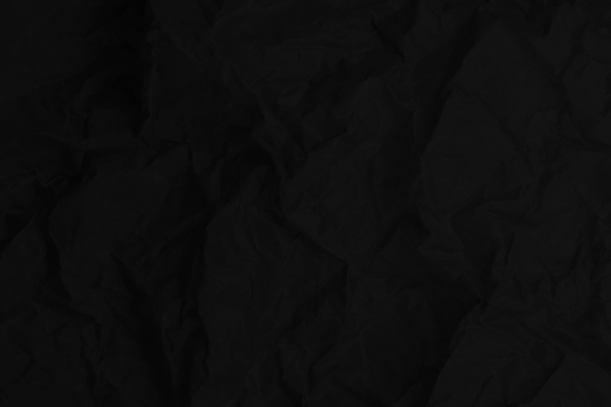 Black paper texture background, crumpled pattern, blank crumpled black paper.